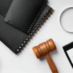 Gavel, clipboard, and legal document labeled Intellectual Property Agreement — symbolizing intellectual property (IP) protection in business.