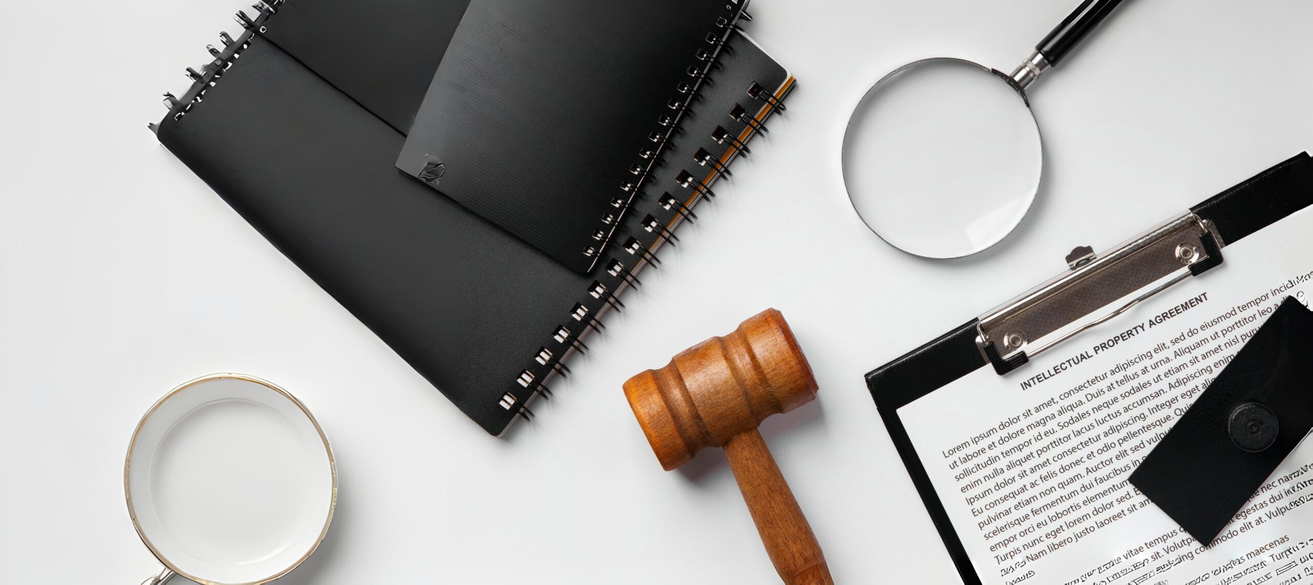 Gavel, clipboard, and legal document labeled Intellectual Property Agreement — symbolizing intellectual property (IP) protection in business.